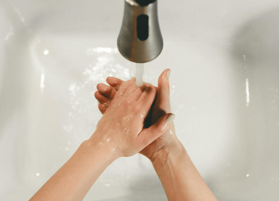 Washing hands in a sink